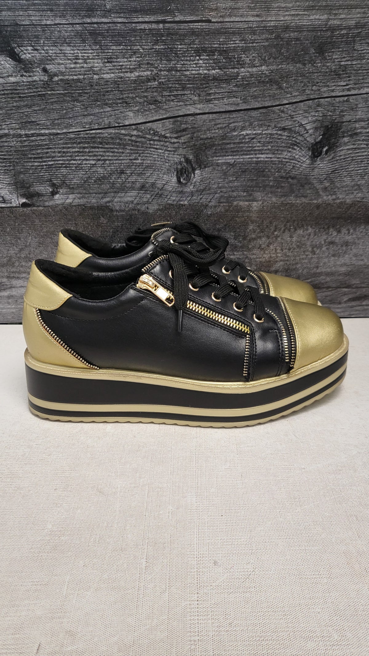 Taking Shape Black/Gold Platform Sneaker (39)
