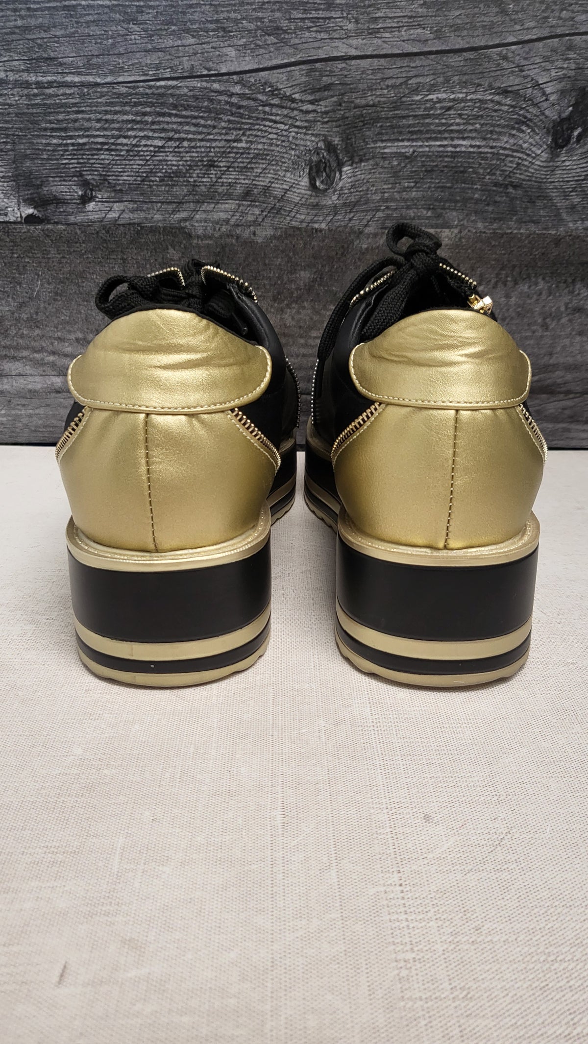 Taking Shape Black/Gold Platform Sneaker (39)